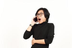 Make a Phone Call Using smartphone with shocked face Of Handsome Asian Man Isolated On White photo