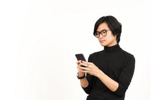 Holding and Using Smartphone with angry face Of Handsome Asian Man Isolated On White Background photo