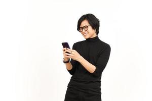 Holding and Using Smartphone with Smiling Face Of Handsome Asian Man Isolated On White Background photo