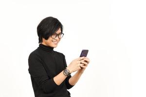 Holding and Using Smartphone with Smiling Face Of Handsome Asian Man Isolated On White Background photo