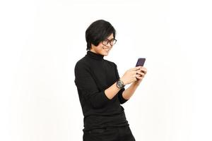 Holding and Using Smartphone with Smiling Face Of Handsome Asian Man Isolated On White Background photo