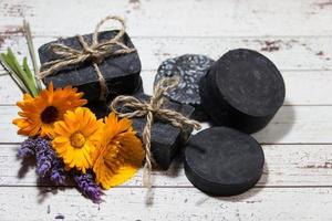 group of handmade cosmetics with activated carbon photo