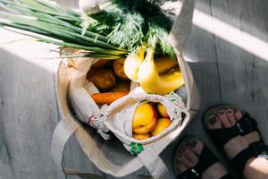 Shop plastic free. Zero waste shopping concept. Eco bags with fresh vegetables and fruits photo