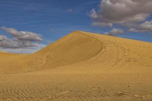 summer desert landscape on a warm sunny day from Maspalomas dunes on the Spanish island of Gran Canaria photo