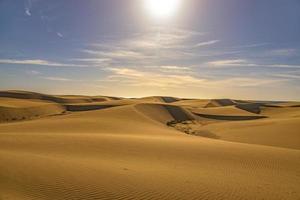 summer desert landscape on a warm sunny day from Maspalomas dunes on the Spanish island of Gran Canaria photo