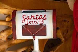 little white-red on a brown background letterbox for Santa Claus photo