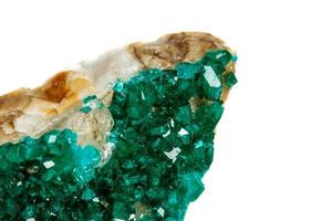 Macro mineral stone Dioptase silicate copper on a white background photo