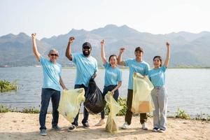 Happy environmental activists in the river a sunny day. Environmental and ecological care, Earth day concept photo