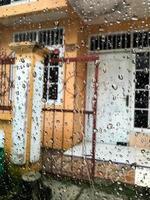 raindrops splashing on the car window photo