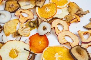 Dried fruits isolated on white background. Healthy eating concept. Top view. Healthy vegetarian food concept. Dried fruit chips. photo