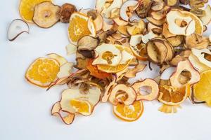 Dried fruits isolated on white background. Healthy eating concept. Top view. Healthy vegetarian food concept. Dried fruit chips. photo