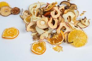 Dried fruits isolated on white background. Healthy eating concept. Top view. Healthy vegetarian food concept. Dried fruit chips. photo