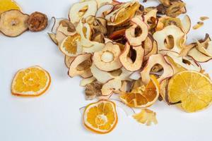 Dried fruits isolated on white background. Healthy eating concept. Top view. Healthy vegetarian food concept. Dried fruit chips. photo