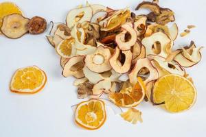 Dried fruits isolated on white background. Healthy eating concept. Top view. Healthy vegetarian food concept. Dried fruit chips. photo