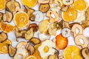 Dried fruits isolated on white background. Healthy eating concept. Top view. Healthy vegetarian food concept. Dried fruit chips. photo