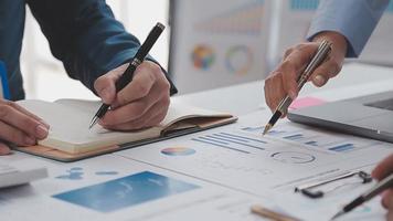 Financial analysts analyze business financial reports on a digital tablet planning investment project during a discussion at a meeting of corporate showing the results of their successful teamwork. video