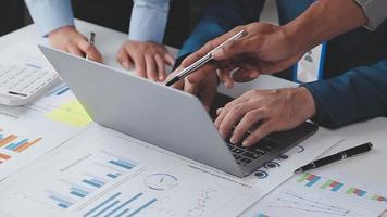 Financial analysts analyze business financial reports on a digital tablet planning investment project during a discussion at a meeting of corporate showing the results of their successful teamwork. video