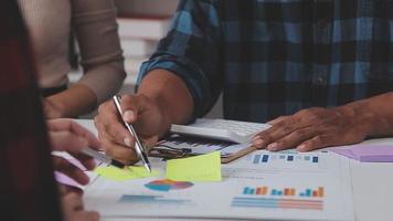Financial analysts analyze business financial reports on a digital tablet planning investment project during a discussion at a meeting of corporate showing the results of their successful teamwork. video