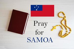 Pray for Samoa. Rosary and Holy Bible background. photo