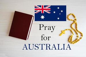 Pray for Australia. Rosary and Holy Bible background. photo