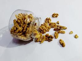 Side view of a bowl with walnuts on rustic photo