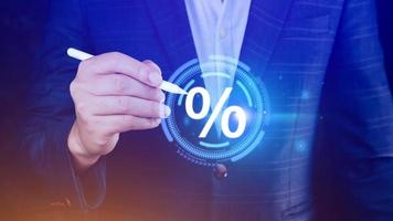 Businessman touching with percentage icon, monetary growth, interest rate increase, inflation concept, Interest rate financial and mortgage rates concept. photo