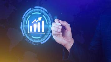 Big data analytics and business intelligence BI concept with chart and graph icons on digital screen interface and business people in the background. photo