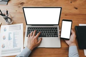 Mockup image of close up business woman working with smartphone laptop and documents in office, mockup concept photo