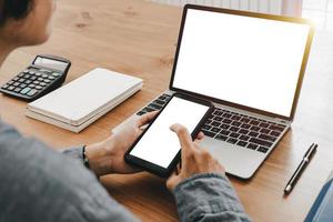 Mockup image of close up business woman working with smartphone laptop and documents in office, mockup concept photo