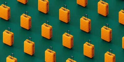 Similar yellow suitcases against green background photo