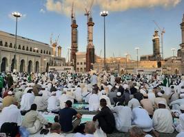 Mecca, Saudi Arabia, April 2023 - Pilgrims from different countries around the world are busy breaking their fast in the courtyard outside Masjid al-Haram. photo