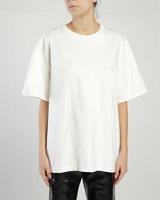 A woman wears a white over size t shirt photo