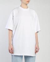 A woman wears a white over size t shirt photo