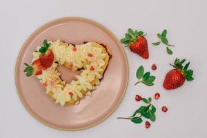 cake with Strawberry and vanilla cream. heart Biscuit photo