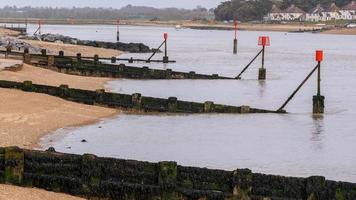 Sea defense groynes at low tide photo