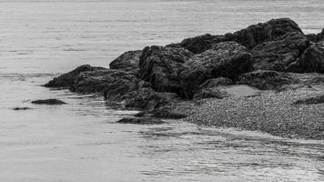 Rocks exposed by low tide photo