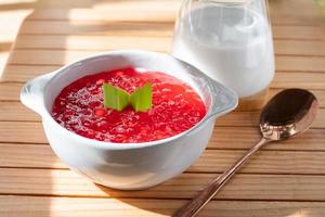 Pearl Porridge or pearl sago. Popular Indonesian desserts are commonly encountered during the month of Ramadhan. Served in a ceramic bowl with pandan leaves. photo