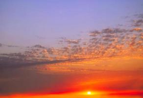 Real amazing panoramic sunrise or sunset sky with gentle colorful clouds. Long panorama, crop it photo