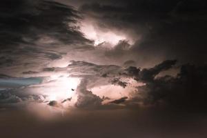 Lightning thunderstorm flash over the night sky. Concept on topic weather, cataclysms photo