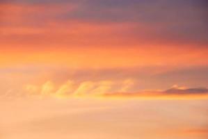 Real amazing panoramic sunrise or sunset sky with gentle colorful clouds. Long panorama, crop it photo