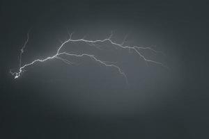 Lightning thunderstorm flash over the night sky. Concept on topic weather, cataclysms photo