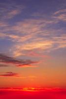 Real amazing panoramic sunrise or sunset sky with gentle colorful clouds. Long panorama, crop it photo