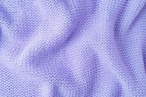 Pastel purple knitwear wool fabric texture background. Abstract textile backdrop photo