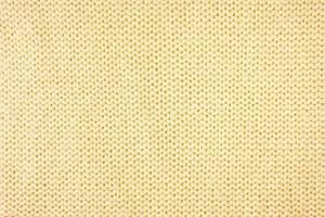 Fondo de textura de tela de lana de punto amarillo brillante. telón de fondo textil abstracto foto
