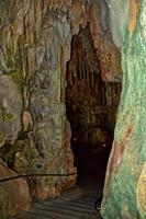 interesting original cave in the Turkish mountains with stalactites and stalagmites creating the background photo