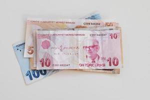 Turkish paper banknotes lying on a white table photo