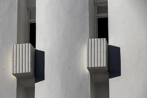 interesting original elements of the balconies in the white building photo