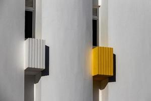 interesting original elements of the balconies in the white building photo