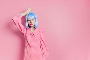 female in blue wig pink dress red lips isolated background photo