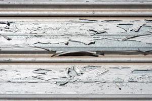 closeup aged garage metal door texture, with peeling paint photo